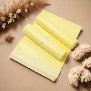 Yellow courier mailing bags detail shot, waterproof thick poly mailers close-up scene.