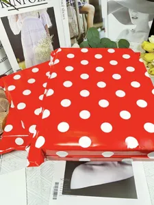 Thick waterproof red polka dot courier mailing bags for clothing shipping and packaging use.