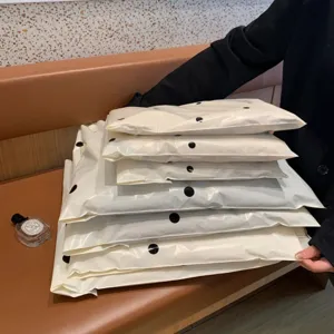 Thickened waterproof courier bags in milk white with black polka dots, stylish packaging.