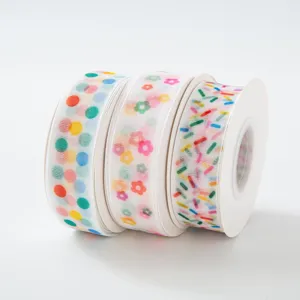 Colorful polka dot and flower sheer ribbon rolls for gift wrapping, party decoration, and cake boxes.