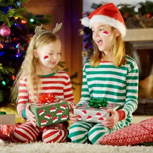 Christmas hat gift stickers details showing children celebrating holidays with festive decorations.
