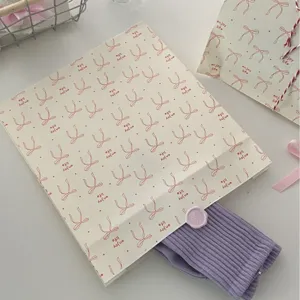 Korean style bow printed white kraft paper bag detail, elegant gift packaging design.