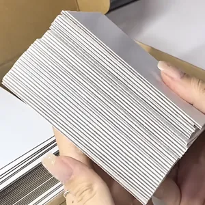 Thick A7 white backing card detail showing sturdy cardboard thickness and size for photocard packing.