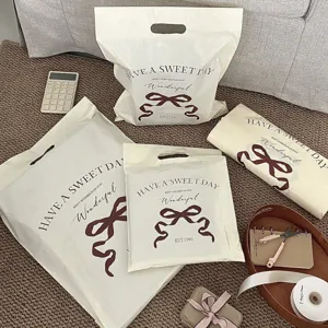 Ins style bow handbag thick waterproof plastic express packaging bag elegant gift bag stylish