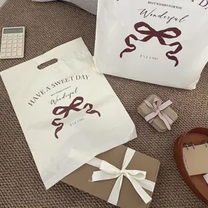 Detail shot of thickened waterproof plastic shopping bags with cute bow and vintage text prints.