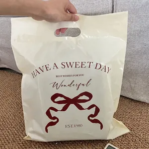 Thickened waterproof plastic packaging bag featuring bow print, durable handle and sweet design.