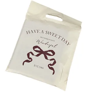 Thickened waterproof plastic shopping handbag with cute bow print and express packing design.