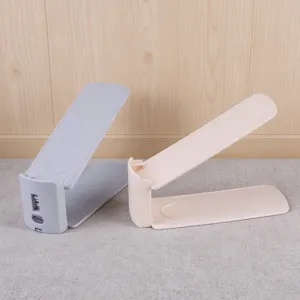 Double layer adjustable shoe rack detail view, plastic shoe slot organizer for tidy closet storage.