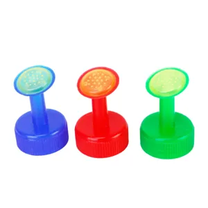 Plastic bottle cap sprinkler attachment detail, multi-color gardening watering tool nozzle.