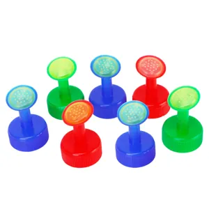 Detailed shot of colorful plastic bottle cap sprinklers for gardening and watering plants.