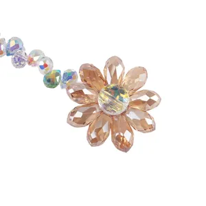 Crystal suncatcher detail showing faceted champagne petals and AB colorful beads hanging.