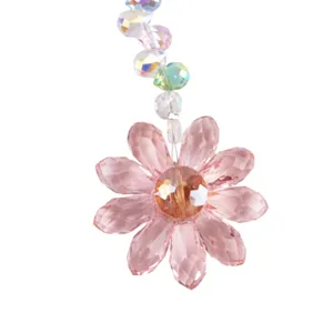 Pink crystal flower suncatcher detail hanging pendant with AB rainbow faceted beads closeup.