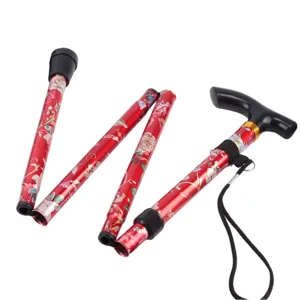 Bâton de marche pliable en aluminium avec motif floral rouge et poignée ergonomique en T.