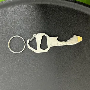 Multi-functional EDC tool key shaped bottle opener with keychain and metric scale details.