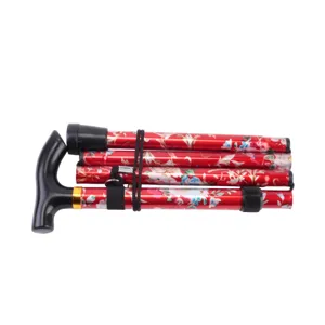Canne de marche pliante en aluminium rouge a motif floral, aide a la mobilite detail.