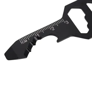 Close-up detail of black multi-functional EDC pocket tool with metric scale and bottle opener.
