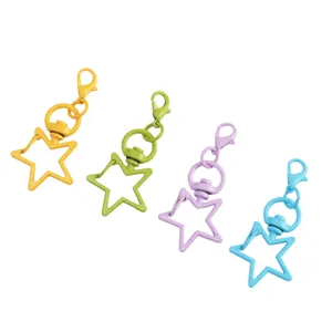 Close-up of colorful star-shaped metal lobster clasp keychains for DIY crafts and handmade accessories.