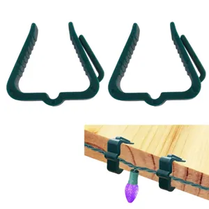 Clips de lumière de Noël en plastique vert durable pour suspendre solidement les guirlandes.