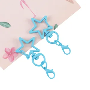 Detailed shot of blue star swivel lobster claw clasps, perfect for DIY handmade keychains.