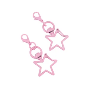 Close-up detail of pink star-shaped rotating lobster clasp keychain DIY accessory.