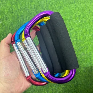 Large aluminum D-shaped carabiner clip with soft foam handle for outdoor use and bag carrying.