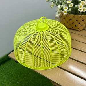 Lime green plastic mesh food cover detail showing fine ventilation holes and handy top handle.