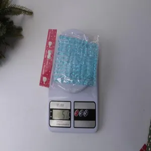 Blue acrylic icicle hanging pendants for Christmas tree decoration and holiday party indoor layout.