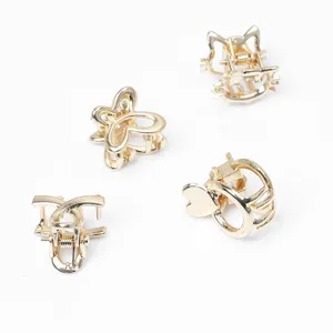 Petit lot de pinces a cheveux metalliques dores avec motifs papillon chat et coeur mignons.