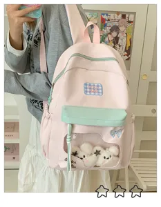 Rosa und mintgrüner Rucksack mit klarem Fenster und süßen Plüschtieren für Schüler.
