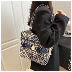 Ethnic style tassel striped tote bag shoulder handbag for women fashion versatile daily travel use.