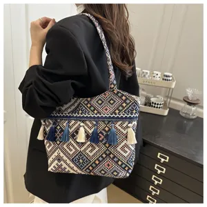 Ethnic style woven tote bag with tassels, stylish casual shoulder bag for women.