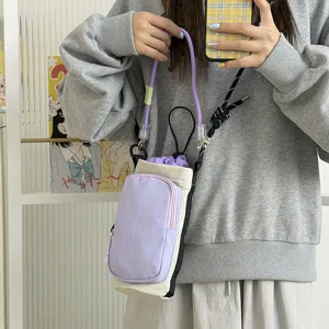 Lightweight colorblock crossbody water bottle bag with drawstring, versatile daily phone pouch.