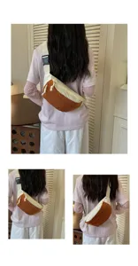 Detailed view of the contrast color crossbody chest bag worn on model, showing back design.