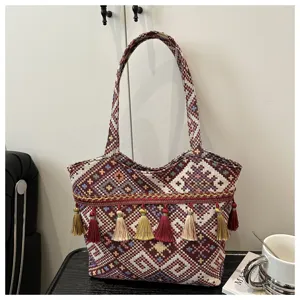 Ethnic style woven tote bag with fringe, vintage striped shoulder handbag for women daily.