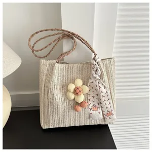 Casual straw woven tote bag for women, stylish shoulder bag with cute flower pendant and scarf.