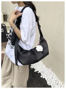 Minimalist solid color nylon shoulder bag for women, stylish underarm crossbody bag.