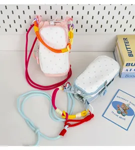 Korean dopamine drawstring crossbody phone bag with cute polka dot pattern, detail view.