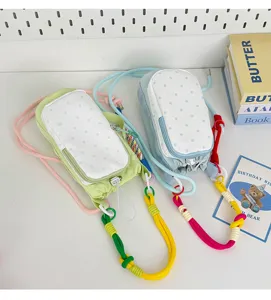 Korean dopamine colorful drawstring crossbody phone bag, polka dot design, daily use.