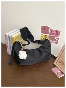 Minimalist black nylon hobo shoulder bag detailed view, casual daily crossbody bag for women.