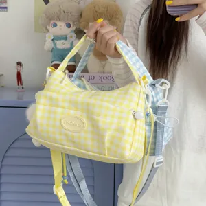Stylish grid crossbody bag with fresh plaid pattern, casual commuter shoulder bag for women.