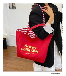 Large capacity nylon tote bag for women, stylish red shoulder bag with red and white pattern.