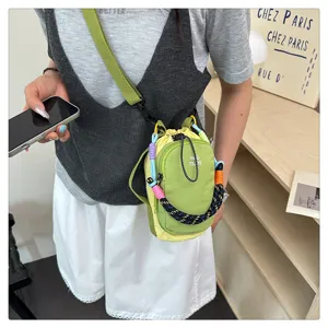 Stylish mini crossbody phone bag for women with contrast color braided handle and strap.