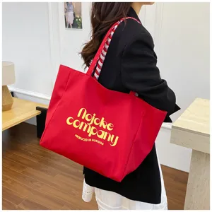 Large capacity nylon tote bag with stylish print and comfortable shoulder straps for daily wear.