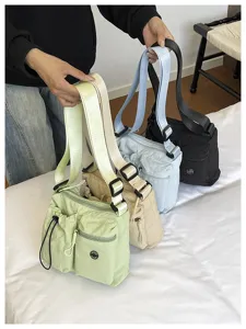 Detailed view of the multi-pocket nylon shoulder bag in various chic colors for daily use.