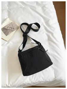 Black nylon shoulder bag detail view, casual commuter crossbody bag for women daily use