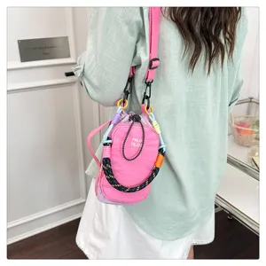 Detailed view of the colorful woven strap mini crossbody bag, perfect for casual outdoor style.