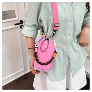 Mini crossbody phone bag with colorblock woven strap, trendy fashion outdoor single shoulder bag.
