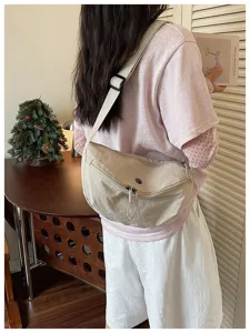 Casual crescent crossbody bag for women, lightweight nylon commuter dumpling shoulder bag.