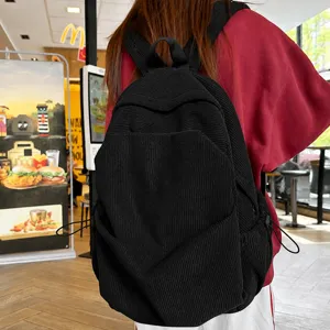Classic black corduroy backpack for women and men, vintage casual school book bag daily use.