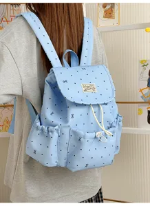 Japanischer süßer blauer Rucksack mit Polka-Dots und Schleifen-Druck für tägliche Reisen.